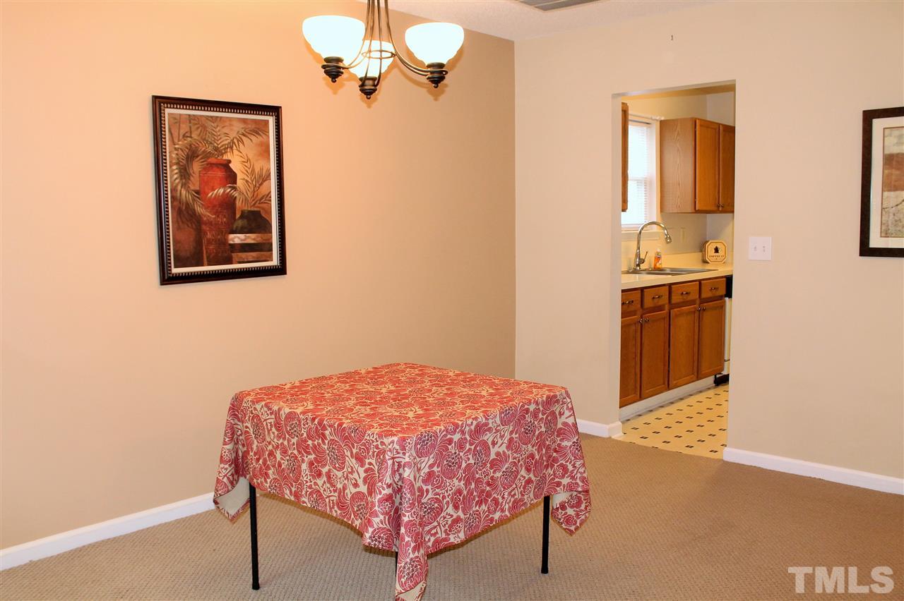 5022 Gable Ridge Drive Durham, NC 27713 - Photo 6 of 24 a bedroom with a bed and a table