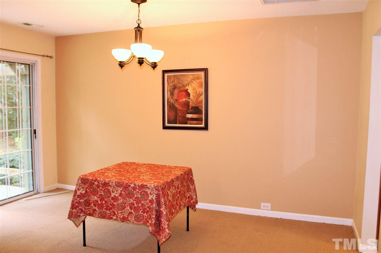 5022 Gable Ridge Drive Durham, NC 27713 - Photo 7 of 24 a bedroom with a bed and a window