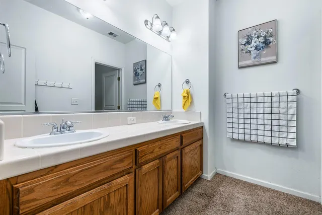 a bathroom with a bathtub and a shower curtain