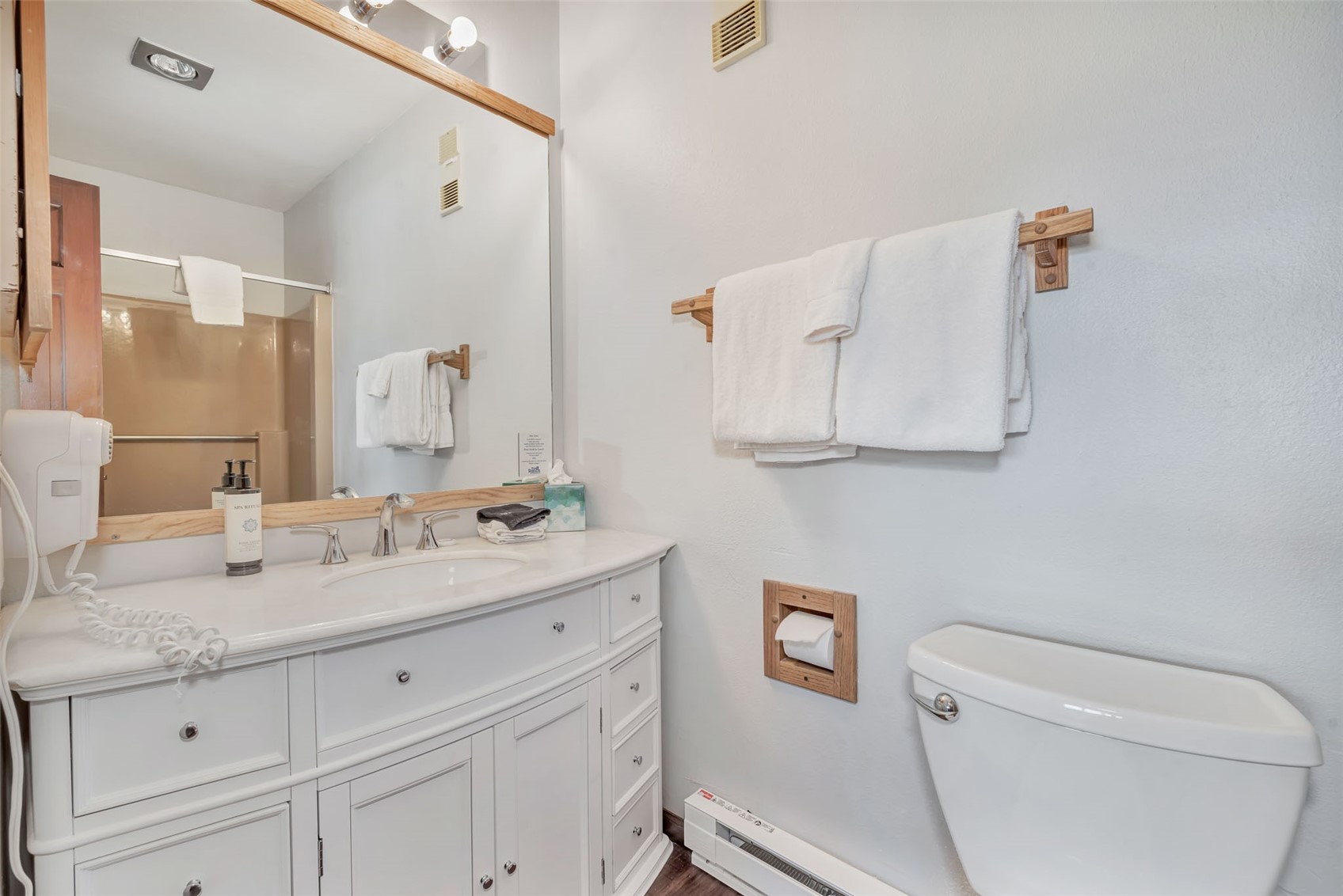1720 Ranch Road, Unit 309 Steamboat Springs, CO 80487 - Photo 22 of 43 a bathroom with a granite countertop toilet sink and mirror