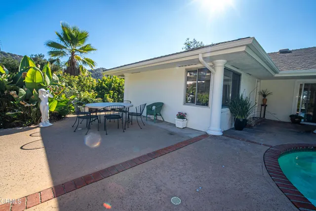 a living room with fireplace furniture and a wooden floor