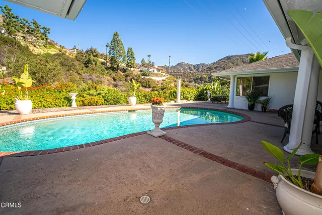a bathroom with a shower a toilet and a sink