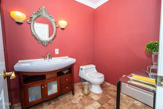 a bedroom with furniture and a wooden floor