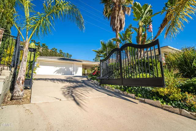 a view of a house with a backyard porch and sitting area