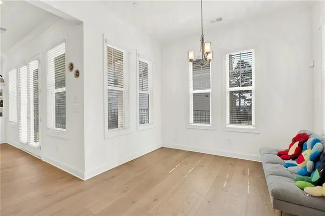 a view of livingroom with furniture wooden floor and windows