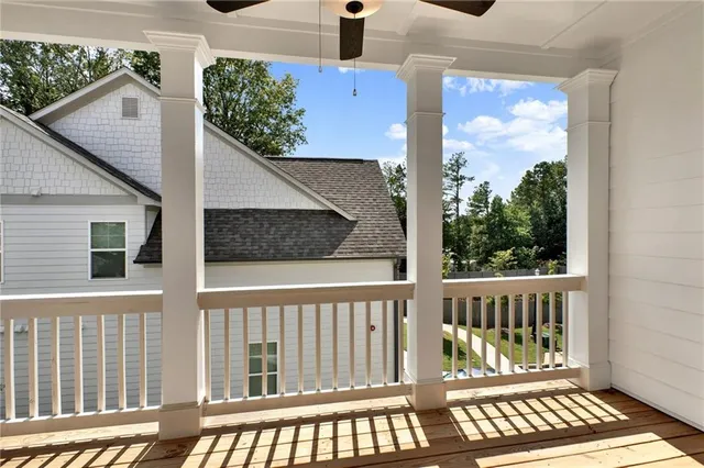 a view of a wooden deck and a yard