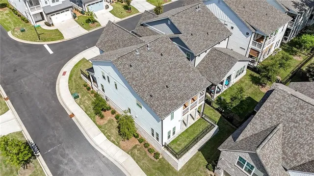 an aerial view of a house with a swimming pool