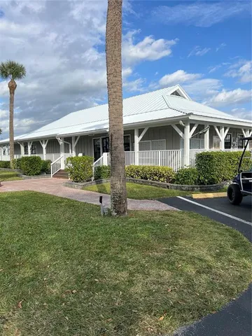 a view of a garden with an apartment