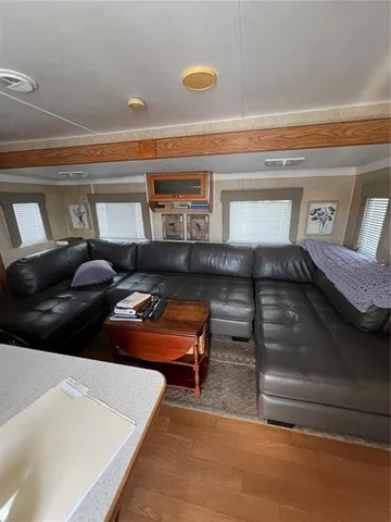 a bedroom with a bed and chair