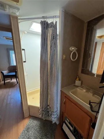 a bathroom with a toilet and a shower