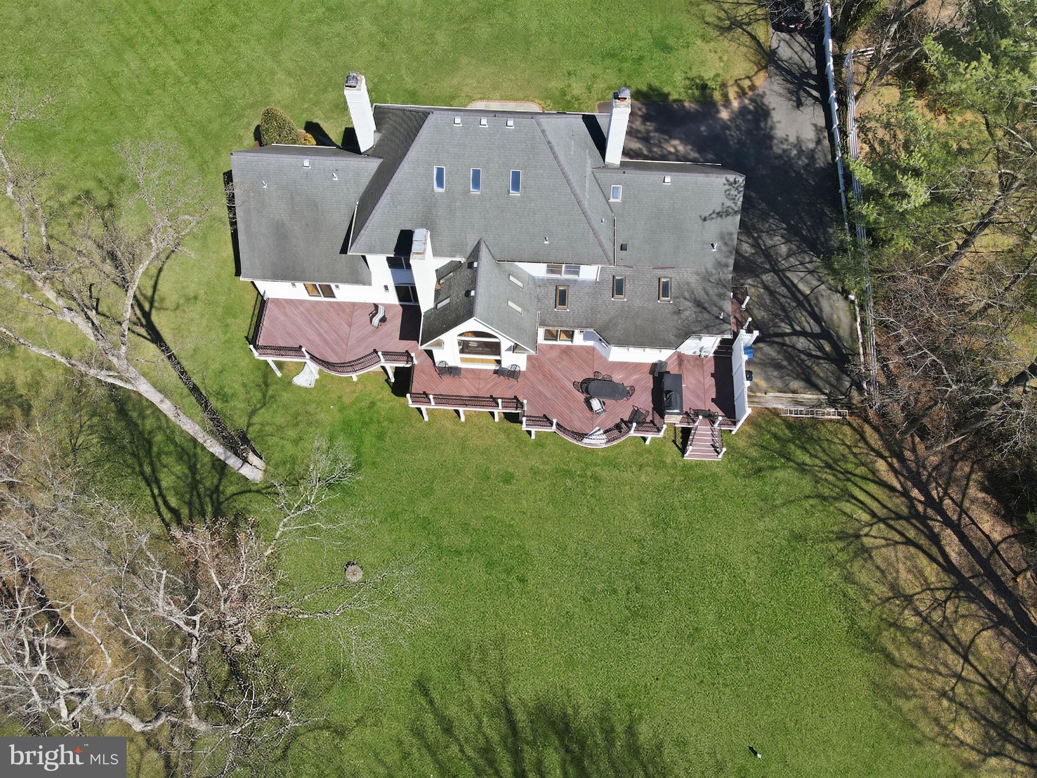 310 Springvale Road Great Falls, VA 22066 - Photo 49 of 59 an aerial view of a house with a garden and trees