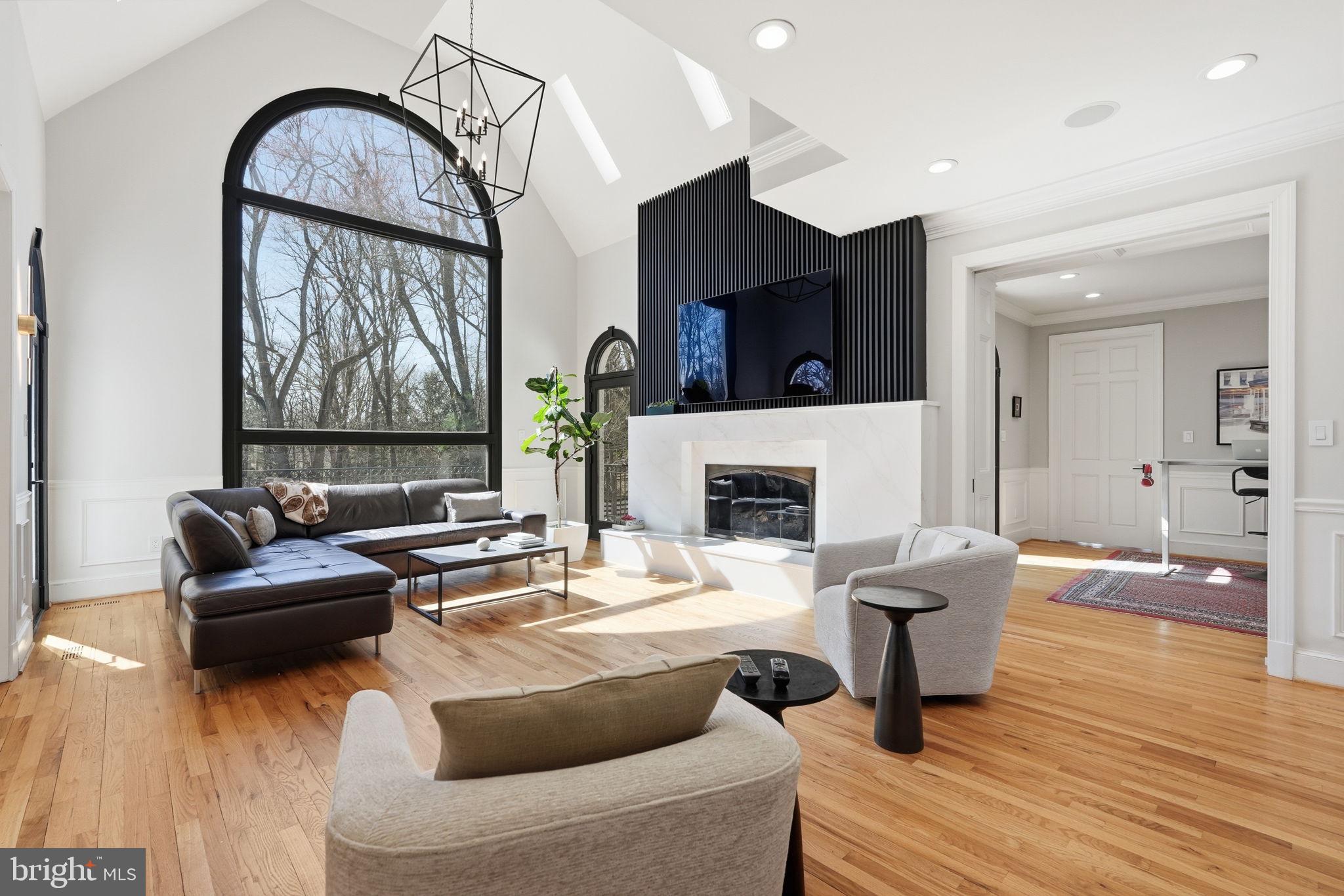 310 Springvale Road Great Falls, VA 22066 - Photo 6 of 59 a living room with furniture and a fireplace