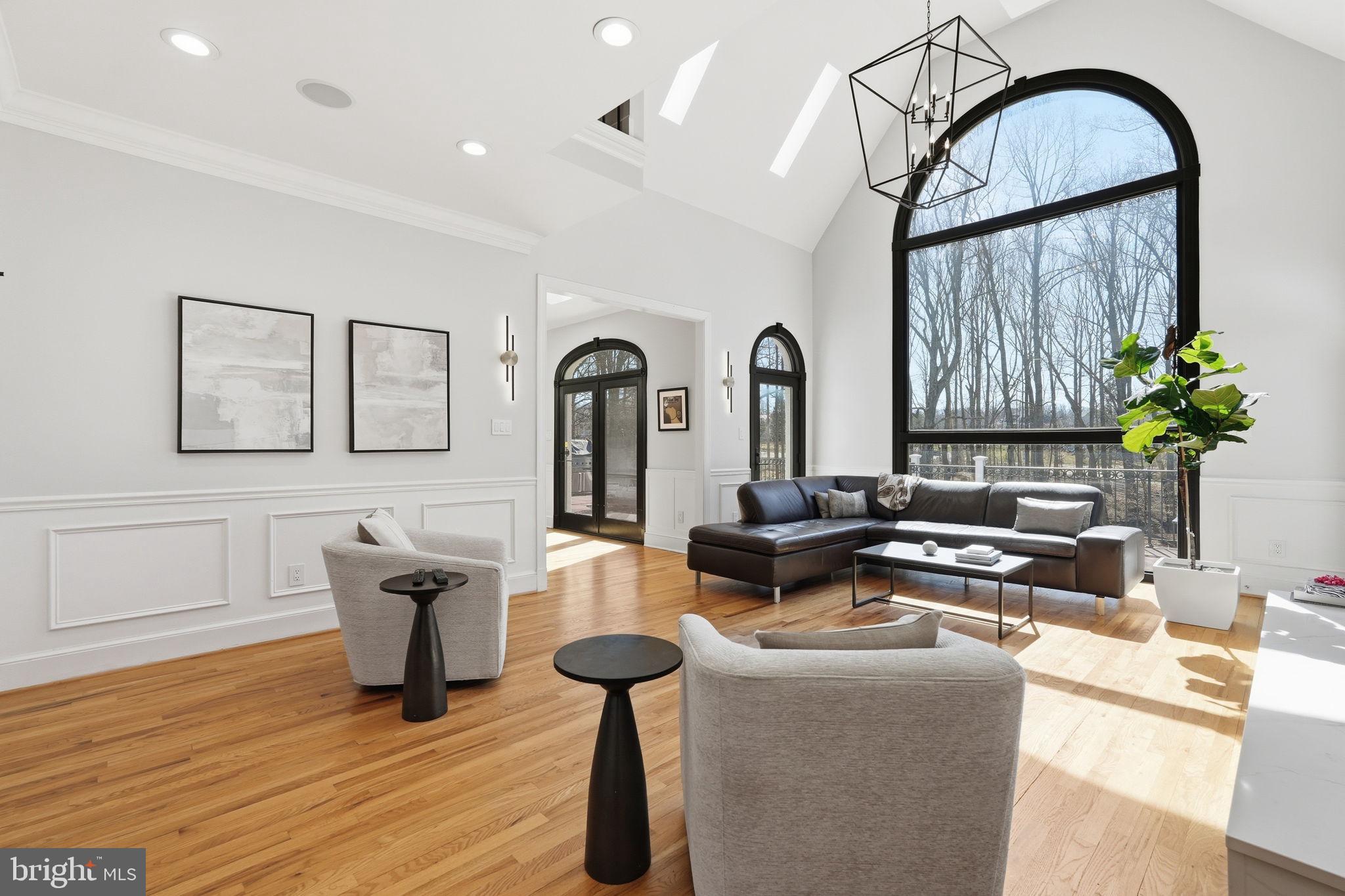 310 Springvale Road Great Falls, VA 22066 - Photo 8 of 59 a living room with furniture a rug potted plant and a window