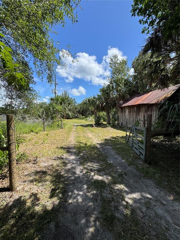 850 Menton Road Pierson, FL 32180 - Photo 23 of 24 a view of a house with a yard