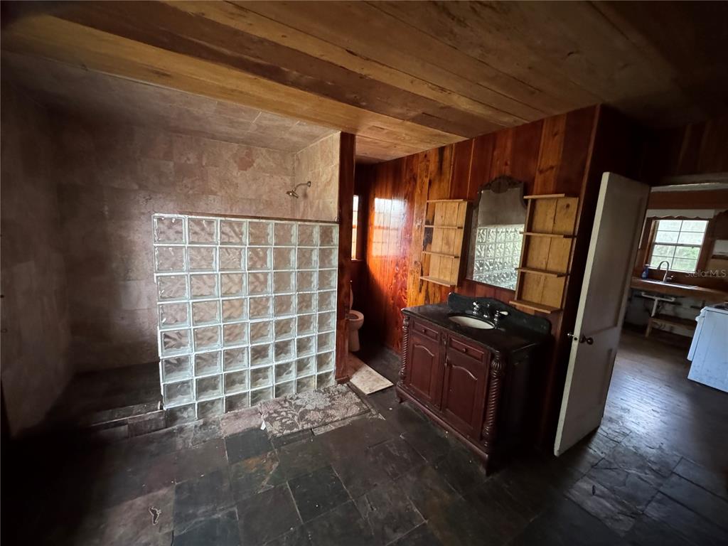 850 Menton Road Pierson, FL 32180 - Photo 5 of 35 a view of an empty room with wooden floor and a window