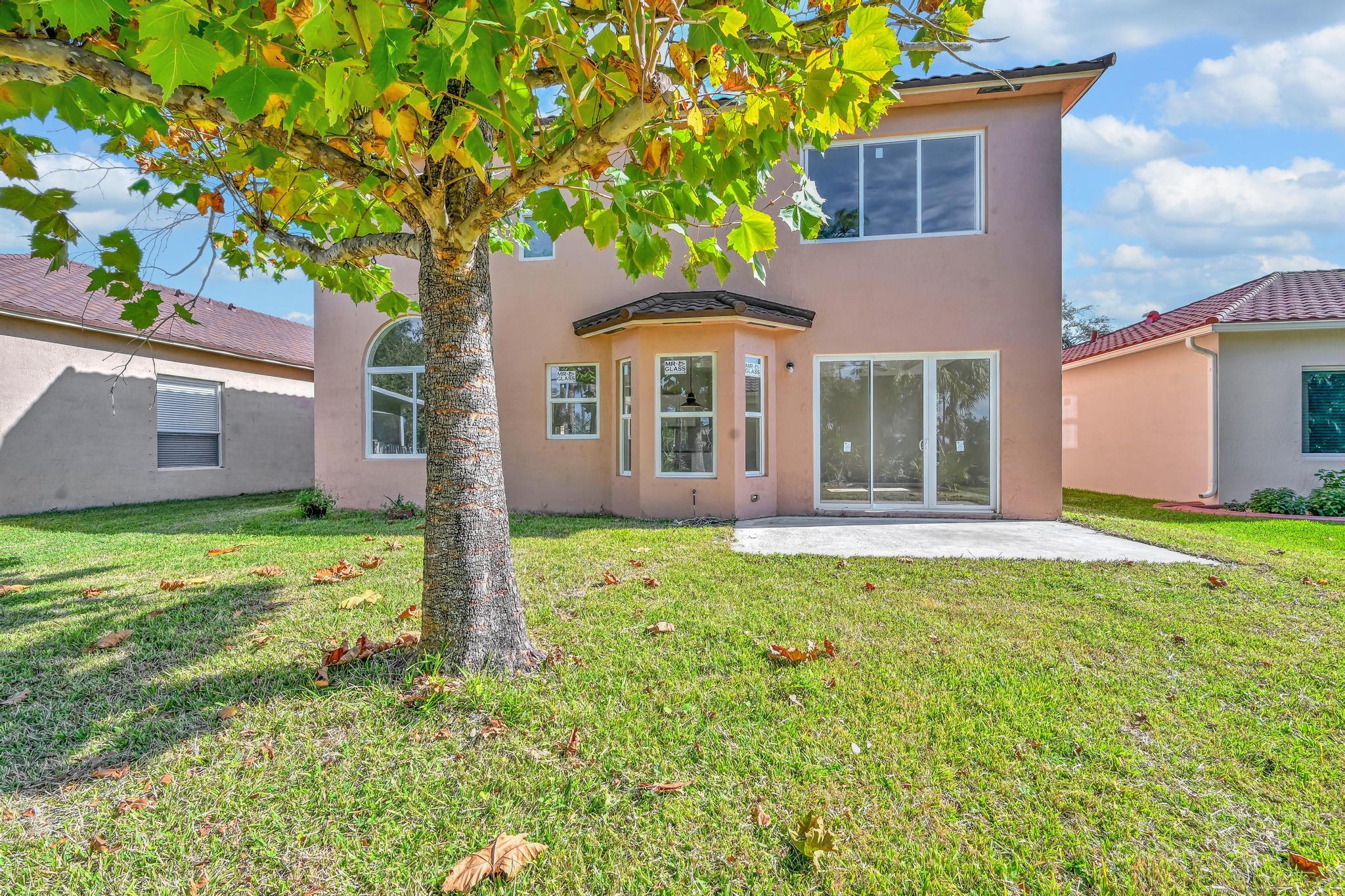 5557 Spanish River Road Fort Pierce, FL 34951 - Photo 26 of 28 a front view of a house with garden