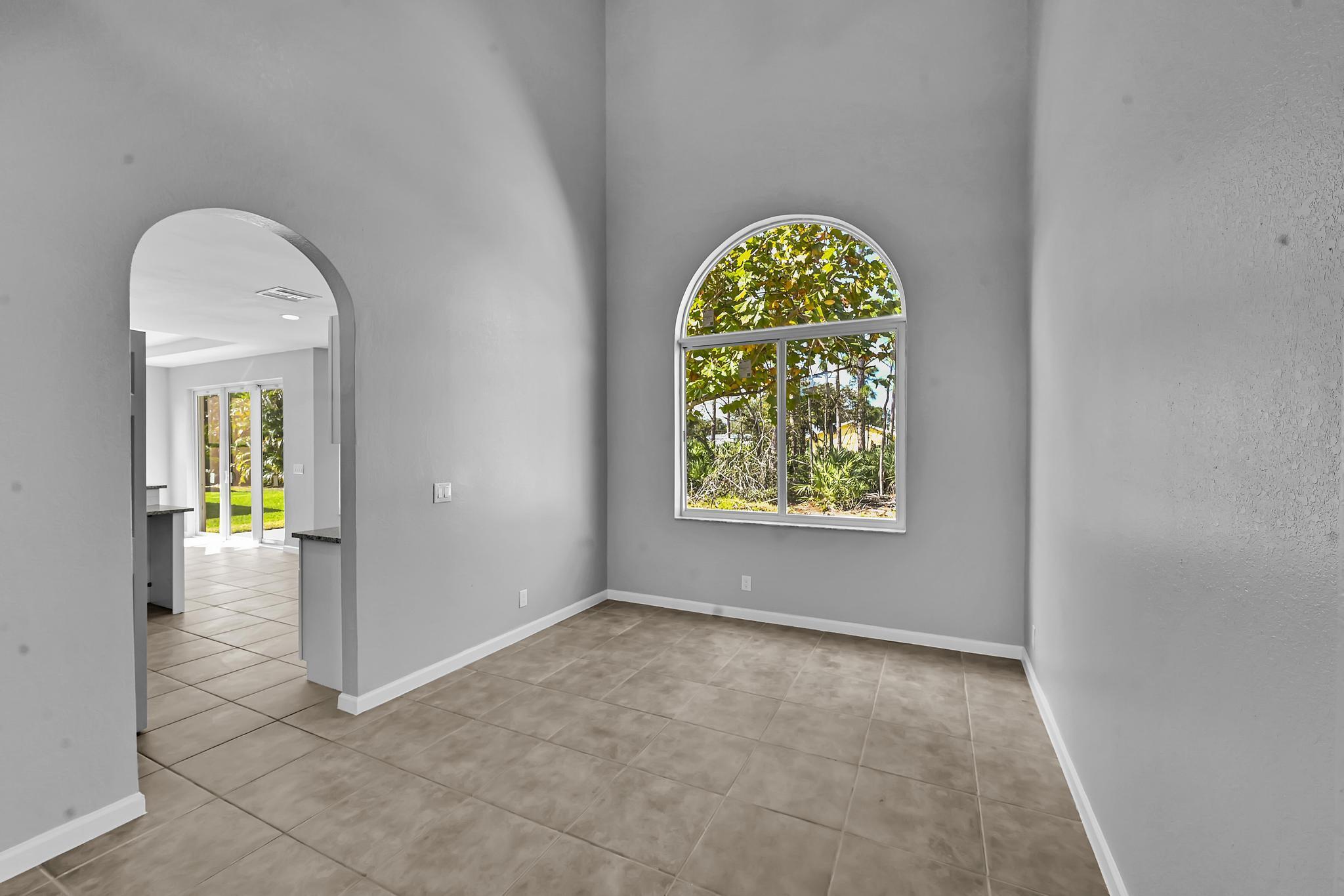 5557 Spanish River Road Fort Pierce, FL 34951 - Photo 8 of 28 an empty room with a window