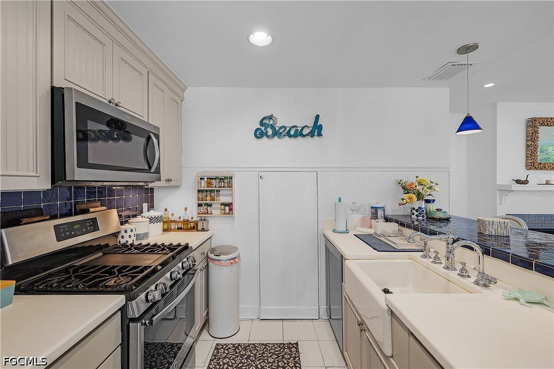 515 Useppa Useppa Island Bokeelia, FL 33922 - Photo 21 of 43 a kitchen with a sink stove and microwave