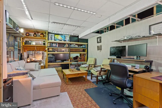 a view of a patio with table and chairs potted plants with wooden floor