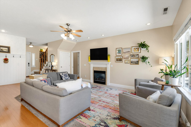 621 East 940 South St. George, UT 84790 - Photo 16 of 55 Bright living area featuring a fireplace with a white mantel, recessed lighting, and a ceiling fan