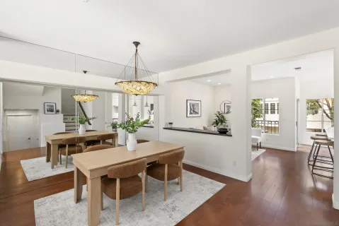 a view of a dining room with furniture window and wooden floor