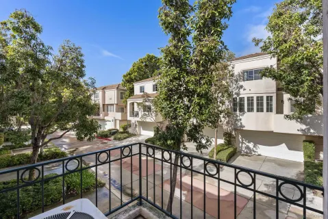 a view of a balcony with a tree