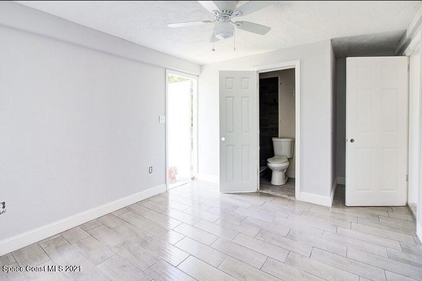 2806 Tropic Road Melbourne, FL 32935 - Photo 2 of 17 a view of an empty room with closet and a window
