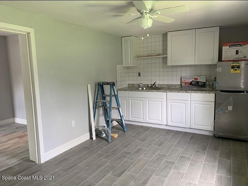 2806 Tropic Road Melbourne, FL 32935 - Photo 12 of 17 a view of a kitchen with electric appliances
