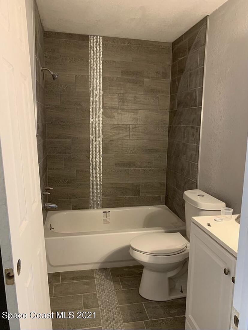 2806 Tropic Road Melbourne, FL 32935 - Photo 14 of 17 a bathroom with a toilet and a shower