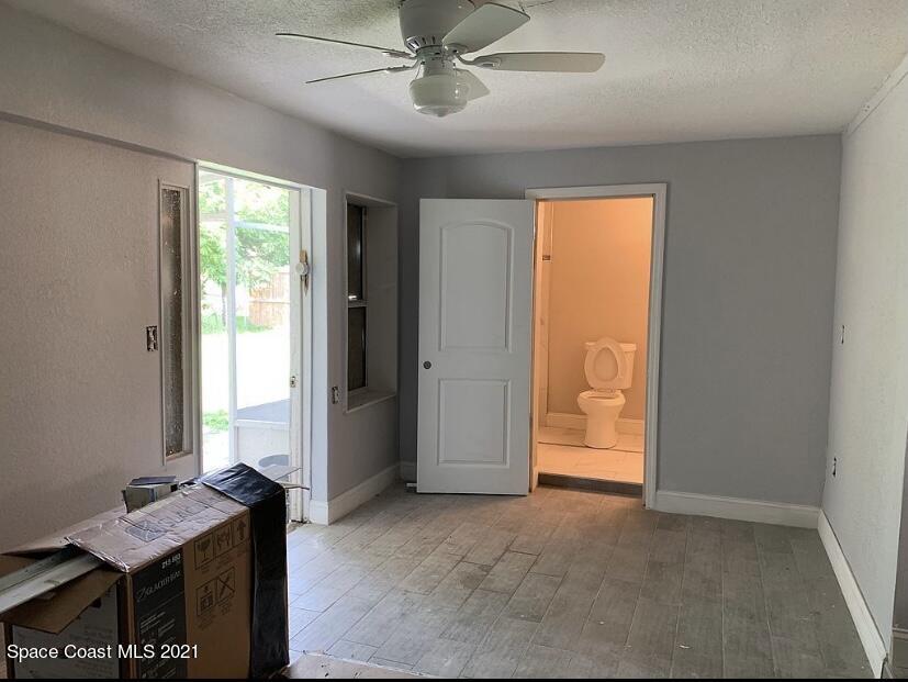 2806 Tropic Road Melbourne, FL 32935 - Photo 7 of 17 a view of an empty room with a window
