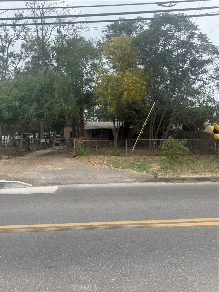 a view of a swimming pool and a yard