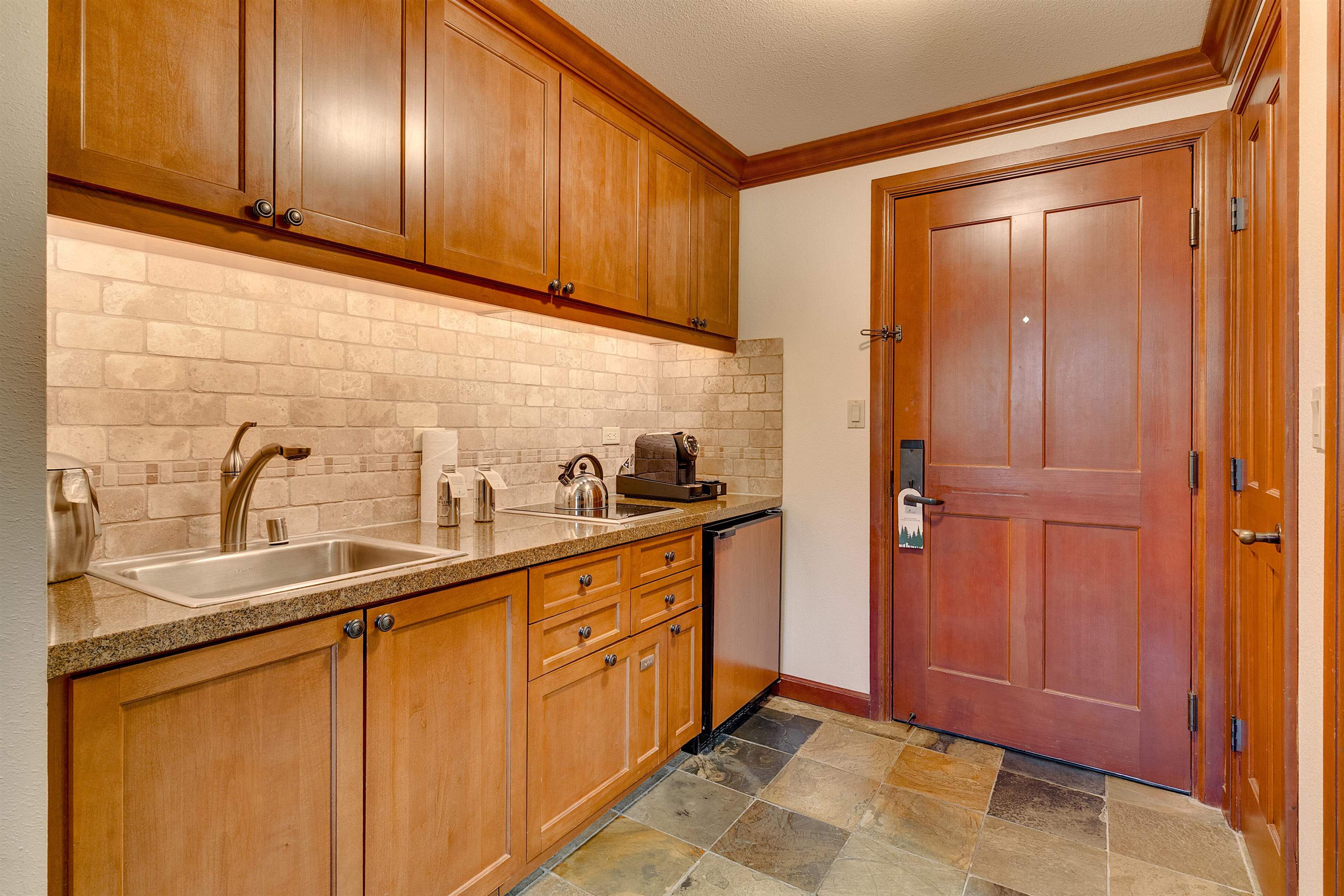 400 Resort Road, Unit 310 312 Olympic Valley, CA 96146 - Photo 2 of 21 a kitchen with stainless steel appliances granite countertop a sink and cabinets