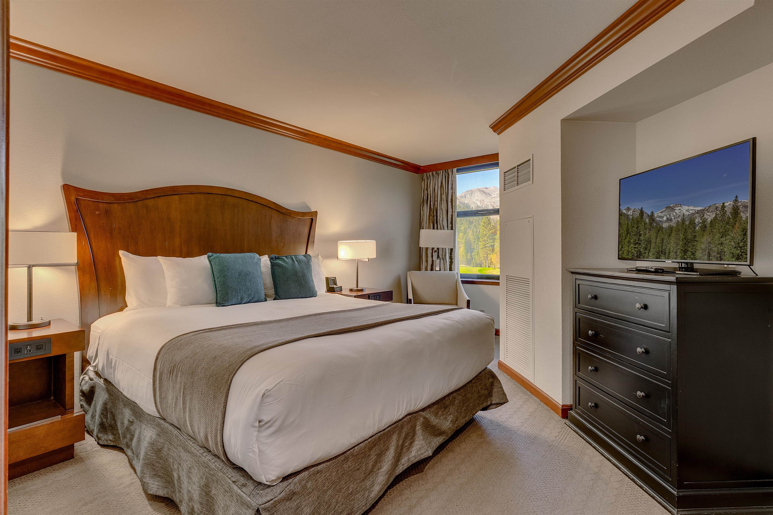 400 Resort Road, Unit 310 312 Olympic Valley, CA 96146 - Photo 5 of 21 a bedroom with a bed and a flat screen tv