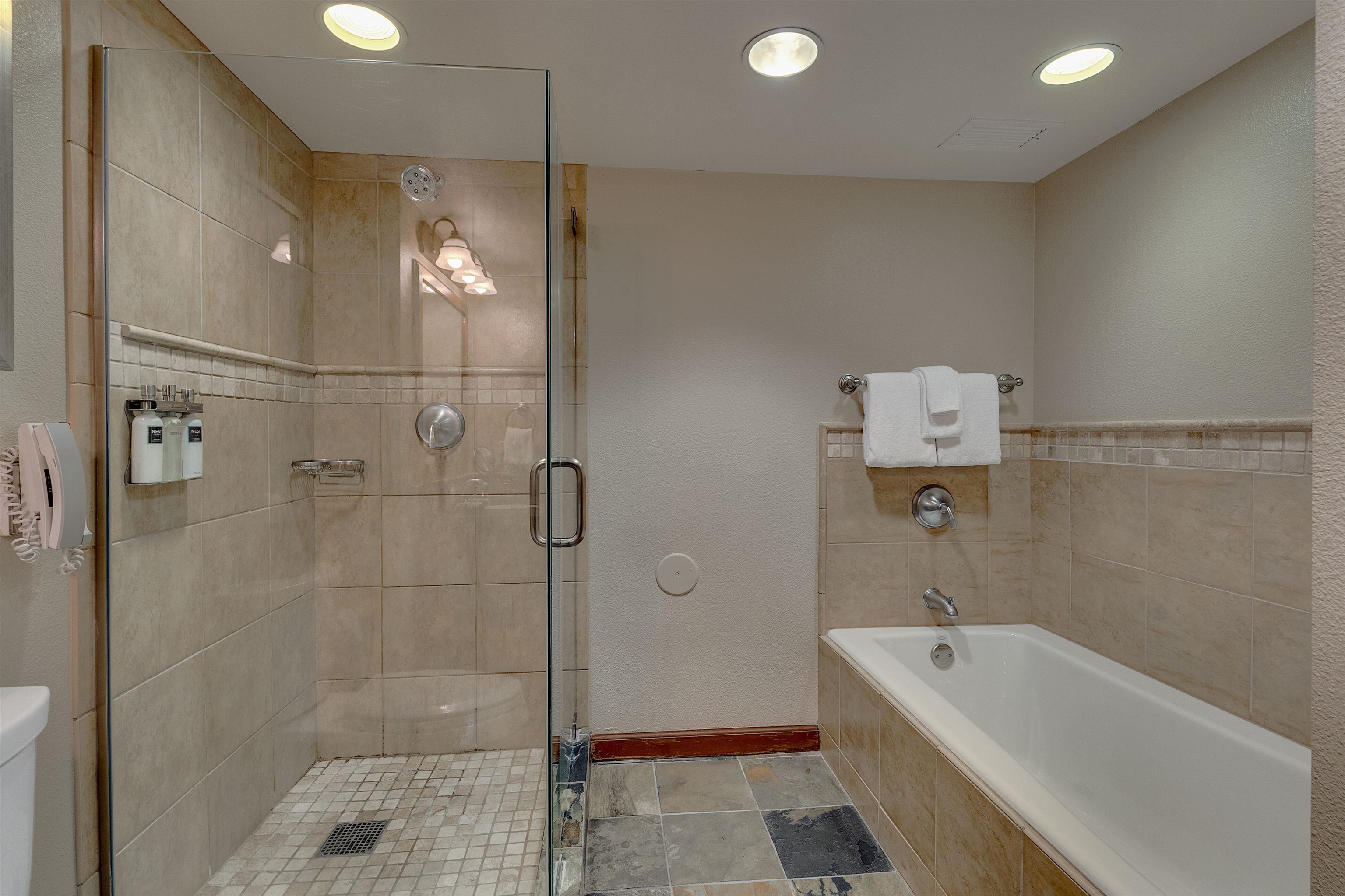 400 Resort Road, Unit 310 312 Olympic Valley, CA 96146 - Photo 7 of 21 a bathroom with a tub a toilet and a shower