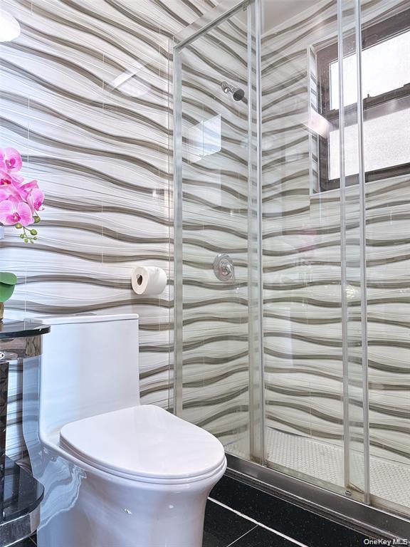 31-47 137th Street, Unit 4C Queens, NY 11354 - Photo 9 of 11 Full bath featuring toilet and a shower stall