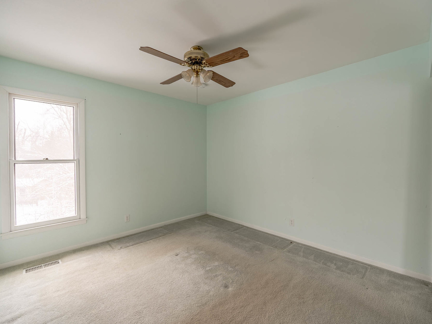 446 Galahad Road Bolingbrook, IL 60440 - Photo 12 of 20 an empty room with a window and a fan