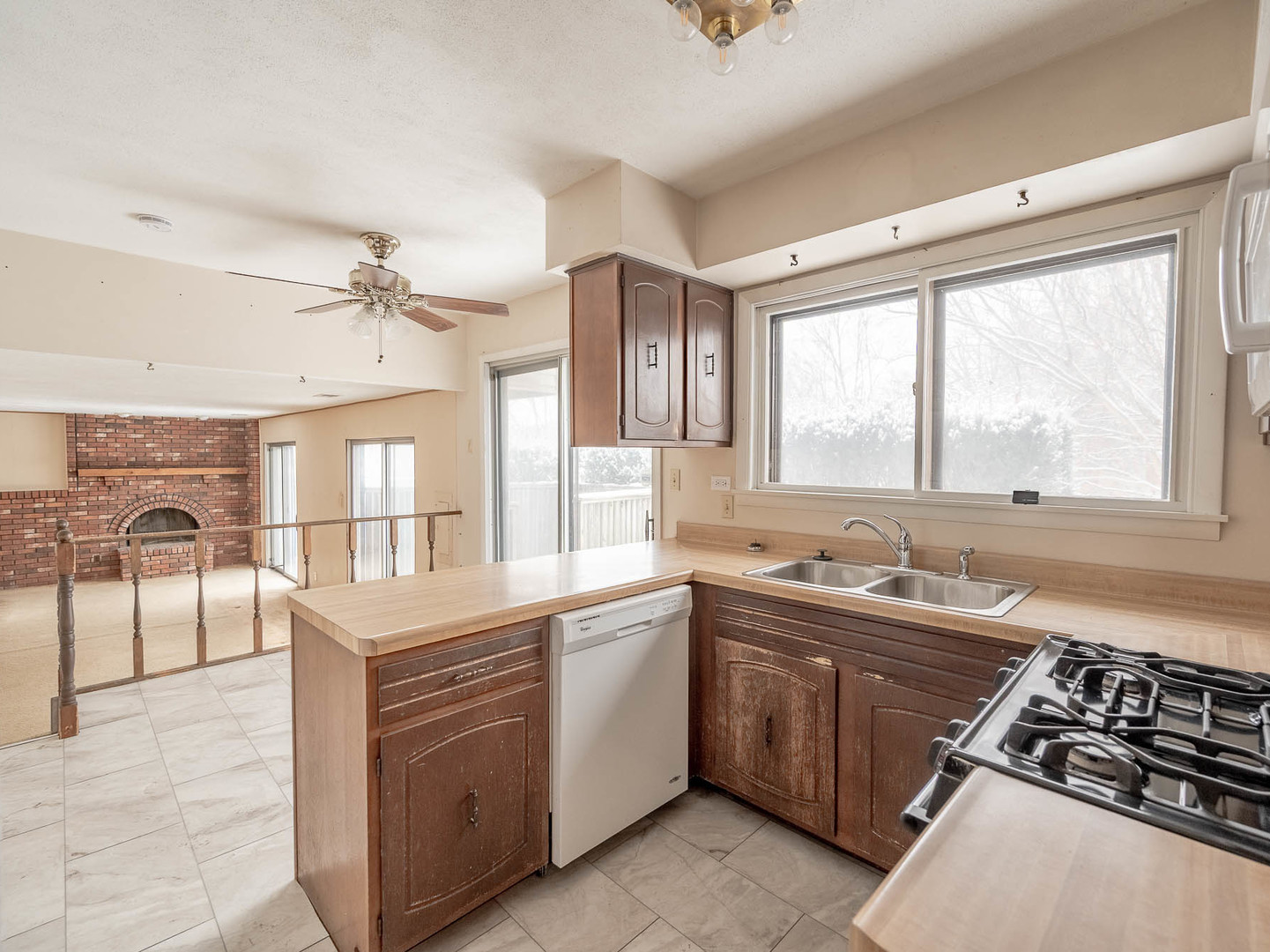 446 Galahad Road Bolingbrook, IL 60440 - Photo 7 of 20 a kitchen with a sink stove top oven and cabinets