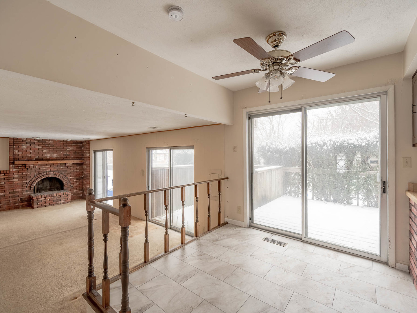446 Galahad Road Bolingbrook, IL 60440 - Photo 8 of 20 a view of a livingroom with a ceiling fan and window