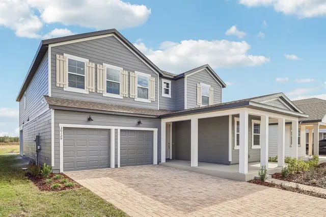 a front view of a house with a garage