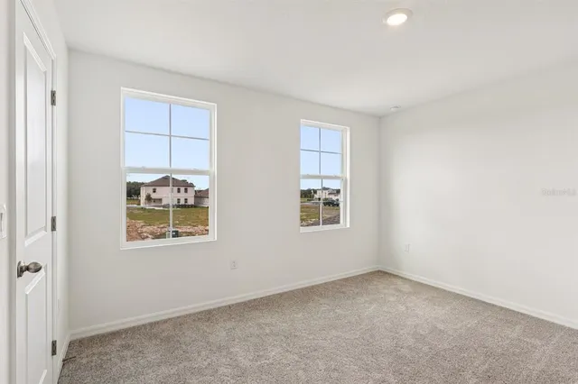 a bathroom with a toilet a sink a mirror and a bathtub