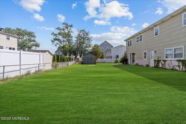 a view of a house with a big yard