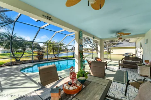 a view of a swimming pool and an outdoor space