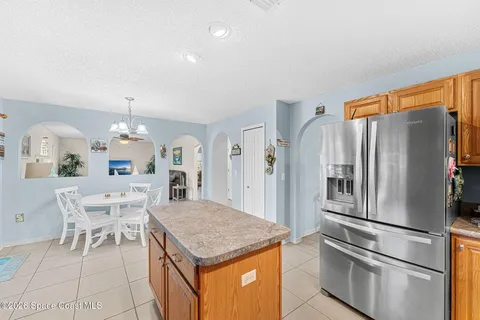 a kitchen with a sink cabinets and window