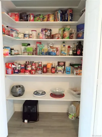 a shelf with cup and plates