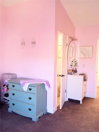 a bathroom with a sink mirror and vanity