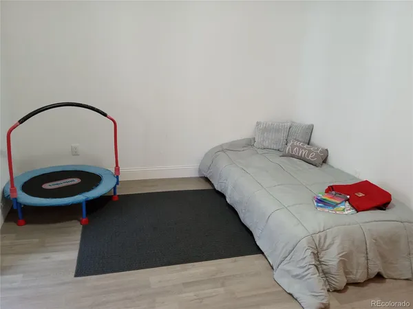 a bedroom with a bed and a table