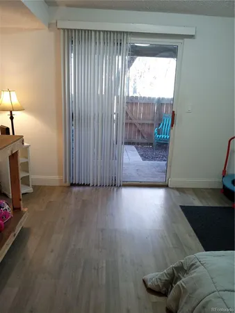 a view of livingroom with furniture and floor to ceiling window