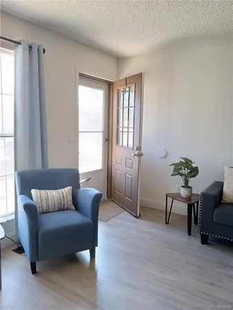 a living room with furniture and windows
