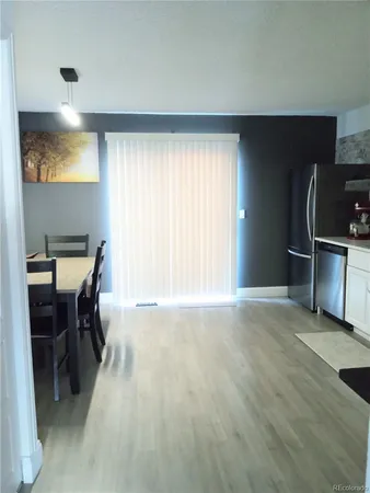 a view of workspace with furniture and window