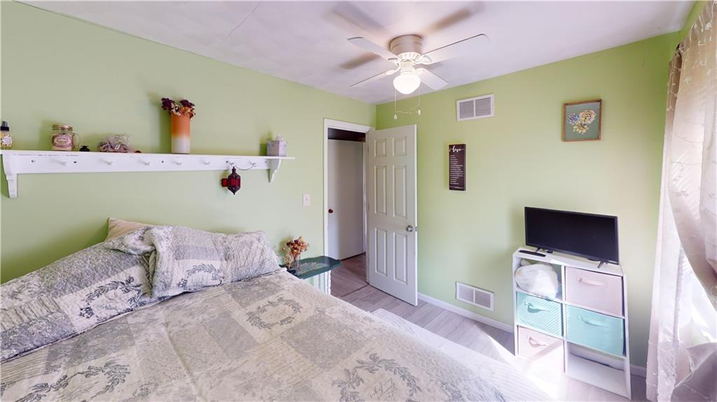225 Fairway Lane Butler, PA 16002 - Photo 23 of 43 a bedroom with a bed and a flat screen tv